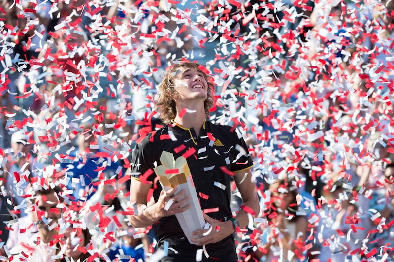 Confetti falls over Alexander Zverev, of Germany, during victory ceremonies after he defeated Roger Federer, of Switzerland, in the final at the Rogers Cup tennis tournament Sunday, Aug. 13, 2017, in Montreal. (Paul Chiasson/The Canadian Press via AP)