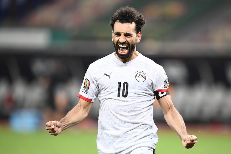 Mohamed Salah celebrates after scoring Egypt's penalty shootout winner against Ivory Coast in the Africa Cup of Nations last-16 match at the Japoma Stadium in Douala on Wendesday, January 26, 2022. AFP