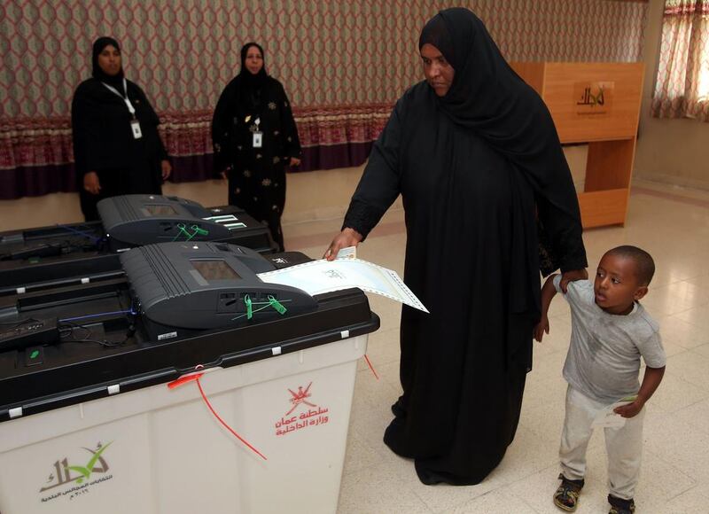 An Omani woman casts her ballot in municipal elections on December 25, 2016 at a polling station in Al Suwayq, northeastern Oman. Mohammed Mahjoub/AFP