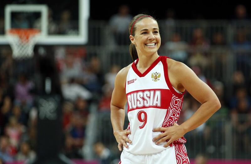 Russia's Becky Hammon smiles toward her bench during the women's preliminary round Group B basketball match against Brazil during the London 2012 Olympic Games. A glass ceiling in major professional sports was cracked on August 5, 2014 when the National Basketball Association champion San Antonio Spurs named long time WNBA star Becky Hammon as the first full-time female assistant coach in NBA history.   REUTERS/Mike Segar