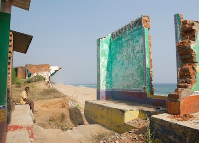 The beautiful hand painted walls of one of the houses still stand as the shoreline is gradually eroded. Taniya Dutta / The National