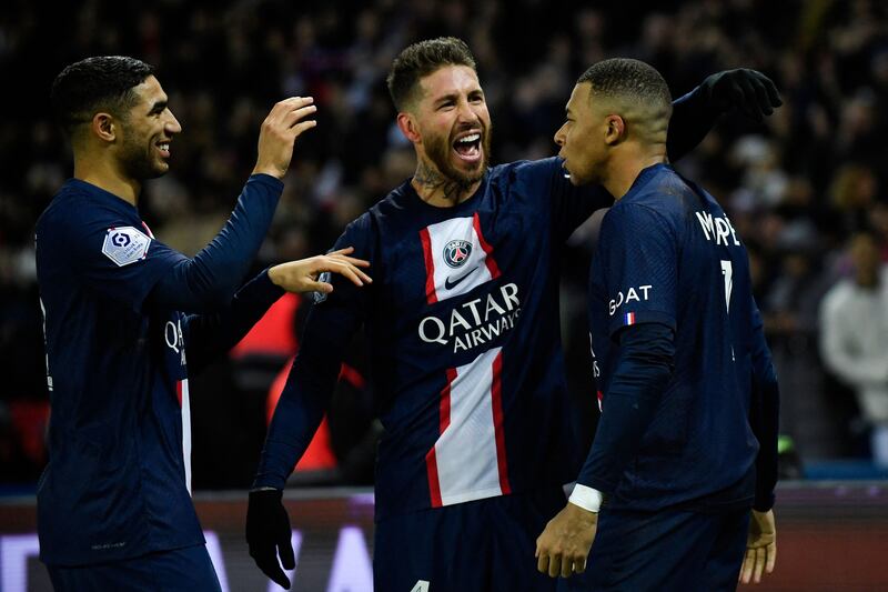 Kylian Mbappe celebrates with Sergio Ramos and Achraf Hakimi. AFP