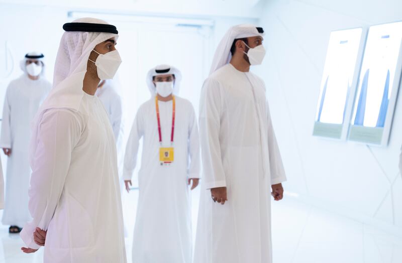 Sheikh Hamdan bin Mohamed bin Zayed (L), visits the Qatar pavilion at Expo.