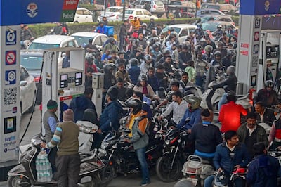Motorists rush to fill up their tanks at a petrol station in Prayagraj on Tuesday after lorry drivers declared a nationwide strike. AFP
