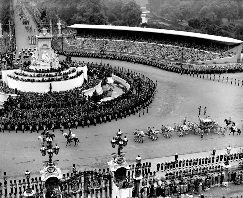 The view from the roof of Buckingham Palace showing the state coach carrying Queen Elizabeth to Westminster Abbey. 