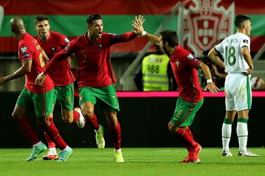 Portugal's Cristiano Ronaldo (centre) celebrates scoring their side's first goal of the game during the 2022 FIFA World Cup Qualifying match at the Estadio Algarve, Portugal. Picture date: Wednesday September 1, 2021.