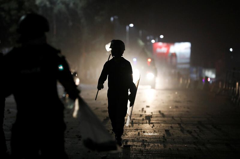 Police officers hold shields to protect from stone pelting during a protest, after dispersing the supporters of the Tehrik-e-Labaik Pakistan Islamist political party, in Karachi, Pakistan. Reuters