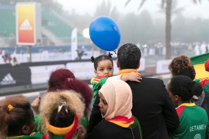 DUBAI, UNITED ARAB EMIRATES - Jan 26, 2018. 

Ethiopian crowd cheer on at the Standard Chartered Dubai Marathon. 

(Photo by Reem Mohammed/The National)

Reporter: Amith
Section: NA + SP