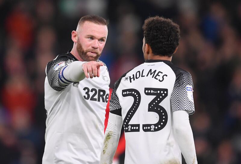 Wayne Rooney with Duane Holmes. Getty