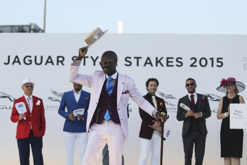 Marlon Weir, centre, wins the Best Dressed Man award at the 2015 Dubai World Cup. Sarah Dea / The National
