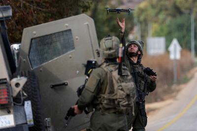 An Israeli soldier launches a surveillance drone near the border with Lebanon. Reuters