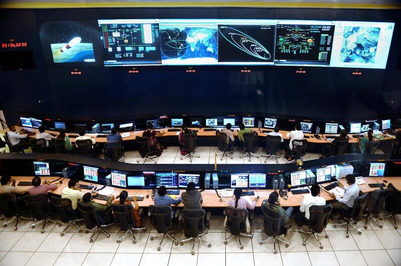 Indian scientists and engineers monitor the Mars Orbiter Mission. Manjunath Kiran / AFP
