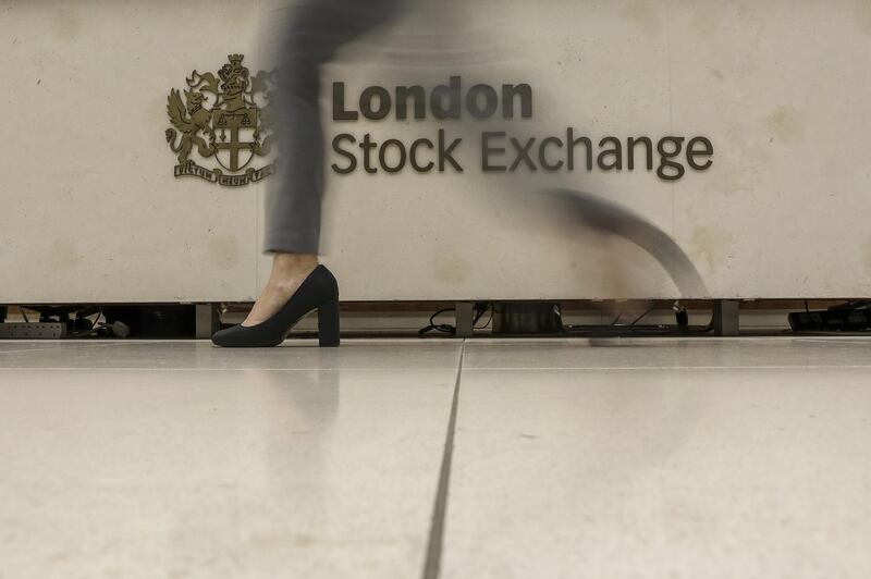 A visitor passes a logo on desk in the atrium of the London Stock Exchange Group Plc's offices in London, U.K., on Thursday, Jan. 2, 2020. Stocks started the year on the front foot, building on strong gains for many asset classes in 2019 as investors cheered the latest policy move by China’s central bank to support its economy. Photographer: Simon Dawson/Bloomberg