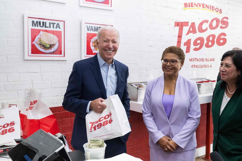 Mr Biden makes a surprise visit to pick up lunch with US Representative Karen Bass and Los Angeles County Supervisor Hilda Solis at Tacos 1986 in California.  AFP