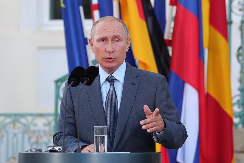 Vladimir Putin, Russia's president, speaks during a joint press conference with Angela Merkel, Germany's chancellor, not pictured, at Schloss Meseberg castle in Meseburg, Germany, on Saturday, Aug. 18, 2018. Putin told Merkel he supports the return of Syrian refugees to their homeland, warning that Europe can’t afford another migration crisis. Photographer: Krisztian Bocsi/Bloomberg