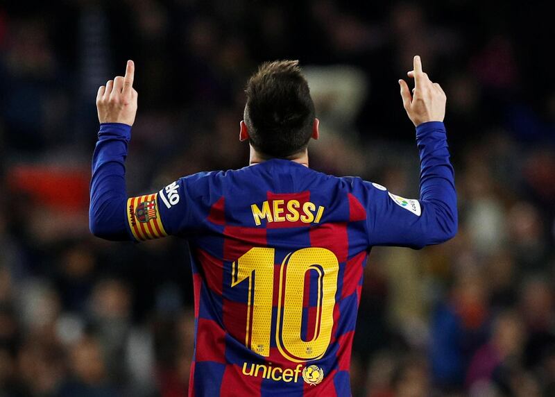 Barcelona's Lionel Messi celebrates scoring his hat-trick. Reuters