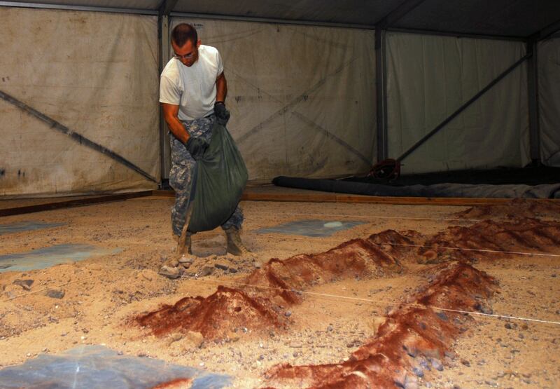 Geospatial engineers from the New York Army National Guard's 27th Infantry Brigade Combat Team construct a sand table. Photo: US Army