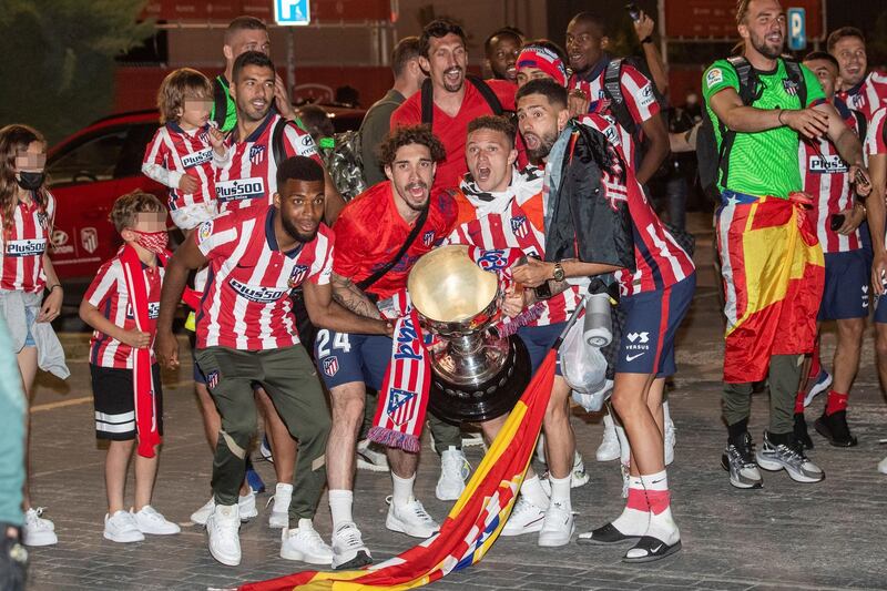 Atletico Madrid players celebrate La Liga title with supporters. EPA