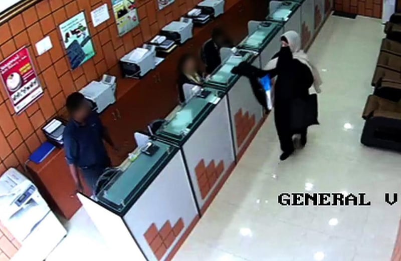 A woman suspected of attempting to rob a currency exchange with a replica gun while dressed in a burqa has been arrested. Courtesy Abu Dhabi police