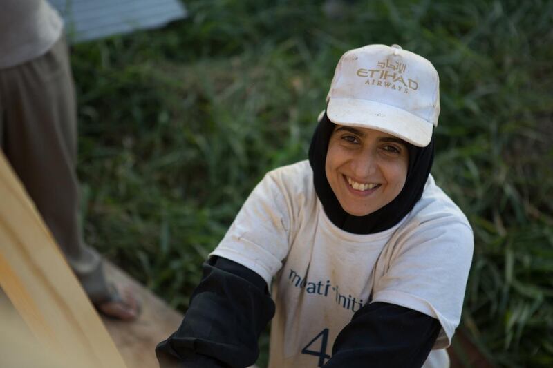 Jameela Al Baloushi an Emirati law student from Al Ain University works on a housing project, for Nadeem Hanif story on a group of volunteers from the UAE who went to a favela in Sao Paulo to help build new houses for local families, it's a project run by Monyati Initiatives, a not-for-profit social development organisation that is based in the UAE.(Photo courtesy-Amelia Johnson) *** Local Caption ***  0E1A3837.jpeg