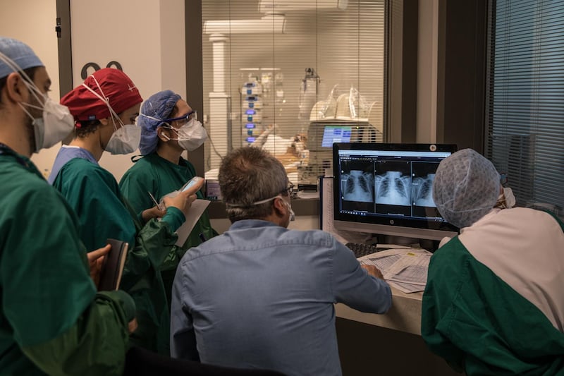 Doctors and nurses look at scans of a patient infected with the Covid-19 virus at the dedicated intensive care unit at the Acibadem Altunizade Hospital in Istanbul, Turkey. Getty