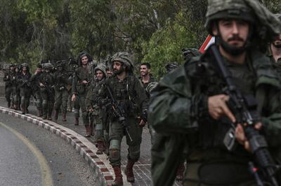 Israeli army soldiers patrol at an undisclosed location in northern Israel near the border with Lebanon on October 15.  AFP
