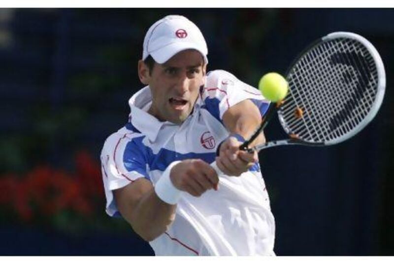 Novak Djokovic on his way to an opening round victory against Michael Llodra.