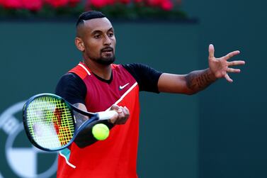 INDIAN WELLS, CALIFORNIA - MARCH 17 Nick Kyrgios of Australia plays a forehand against Rafael Nadal of Spain in their quarterfinal match on Day 11 of the BNP Paribas Open at the Indian Wells Tennis Garden on March 17, 2022 in Indian Wells, California.    Clive Brunskill / Getty Images / AFP
