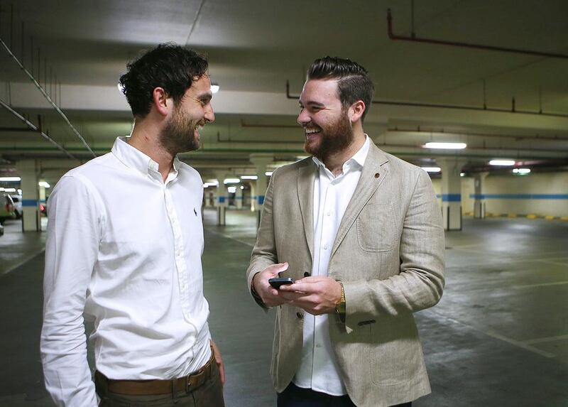 Craig McDonald, right, and Harrison Jones, co-founders of YallaParking, discuss on an ‘Airbnb’ type app for unused parking spaces in Dubai. Ravindranath K / The National