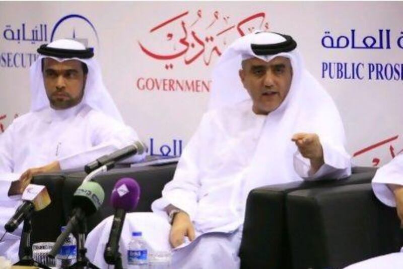 Dubai attorney general Essam Al Humaidan speaks at a press conference with the Dubai Police for the case of a Dubai-based father accused of torturing his daughter. With him is Khalifa Bin Deemas, advocate general.