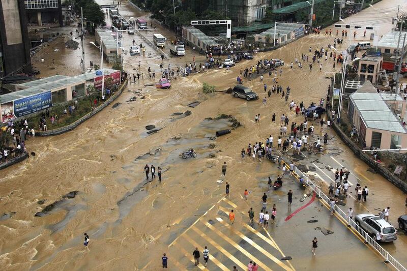 Vehicles come to a standstill at a flooded crossroad in Pingba, Guizhou province. According to Xinhua News Agency, strong rainfall has battered Guizhou province. Reuters