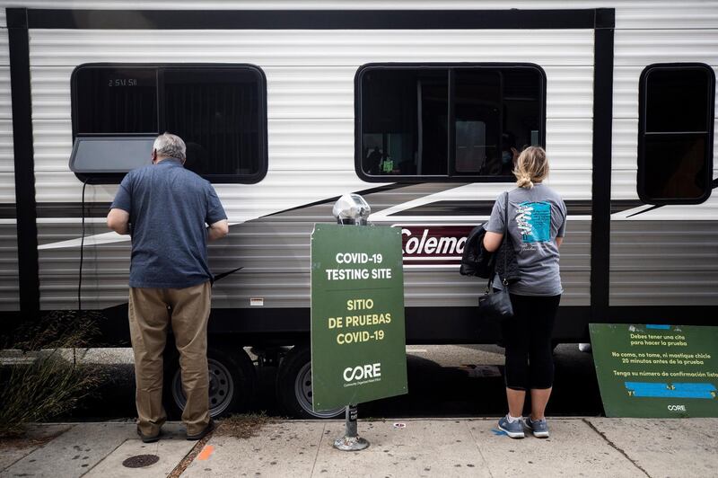 People register to get tested at a Covid-19 mobile testing site amid coronavirus pandemic in Los Angeles, California, USA. EPA