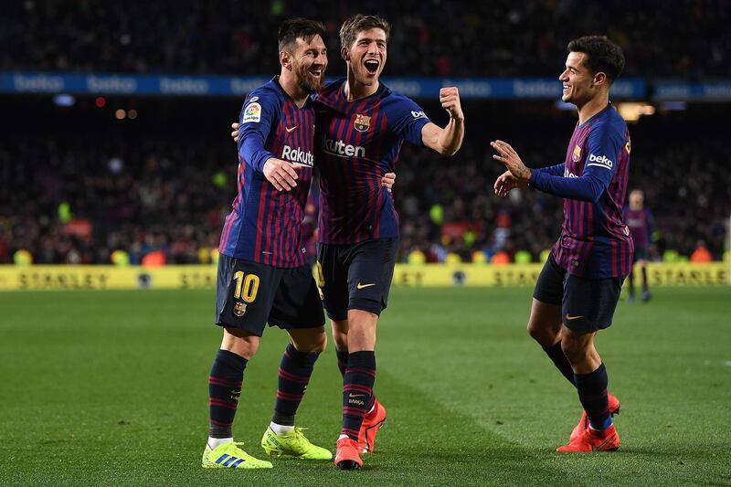 BARCELONA, SPAIN - JANUARY 30: Sergio Roberto (C) of Barcelona celebrates scoring the fourth goal alongside Lionel Messi and Philippe Coutinho during the Copa del Rey Quarter Final  second leg match between FC Barcelona and Sevilla FC at Nou Camp on January 30, 2019 in Barcelona, Spain. (Photo by David Ramos/Getty Images)