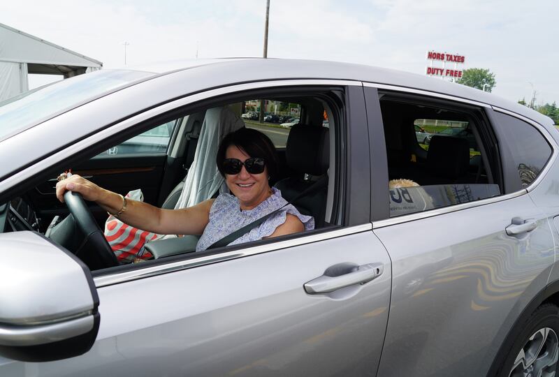 Anna Diraddo poses for a photo on the Canadian side of the US-Canada border in Lacolle, Quebec. Ms Diraddo entered Canada to visit her mother for the first time in more than a year and half. Willy Lowry / The National