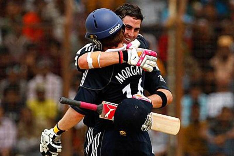 Craig Kieswetter is hugged by Eoin Morgan after reaching his maiden one-day century during the third one-day international between Bangladesh and England in Chittagong yesterday.