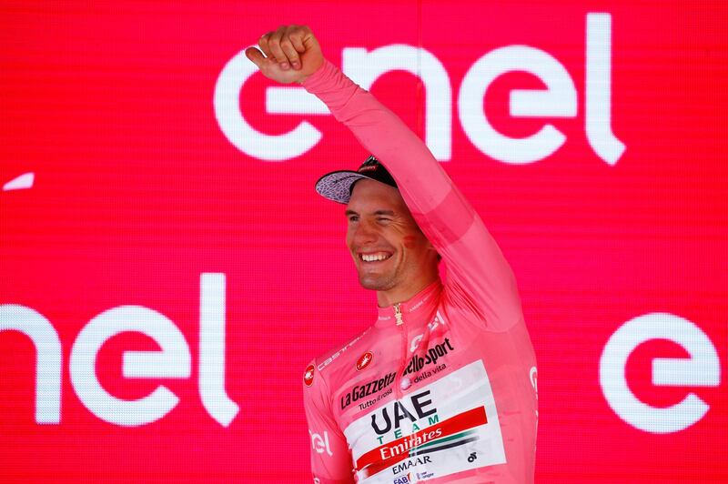 Team UAE Emirates rider Slovenia's Jan Polanc wearing the overall leader's pink jersey celebrates on the podium after stage twelve of the 102nd Giro d'Italia - Tour of Italy - cycle race, 158kms from Cuneo to Pinerolo on May 23, 2019. / AFP / Luk BENIES

