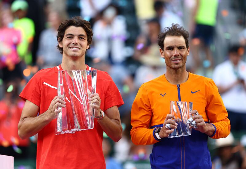 Taylor Fritz holds his winners trophy after his straight sets victory against Rafael Nadal in the Indian Wells final. Getty Images