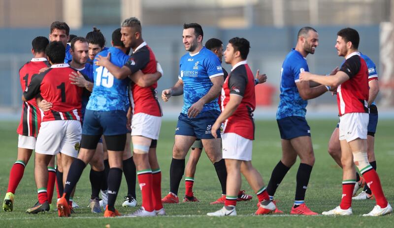 Players of UAE and Israel shake hands after their friendly rugby match in Dubai. EPA