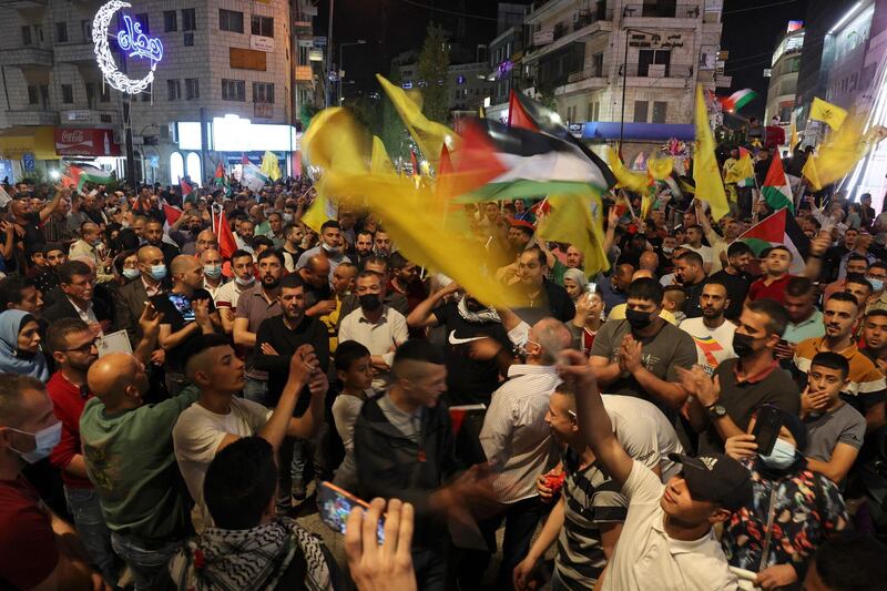 Fatah supporters demonstrate in the West Bank city of Ramallah in solidarity with Palestinian families facing Israeli eviction orders in the Sheikh Jarrah neighbourhood of East Jerusalem. AFP