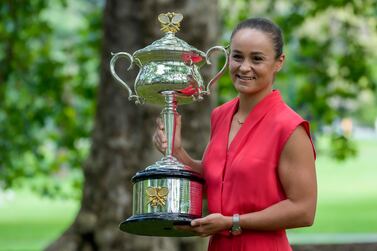 Ash Barty of Australia poses with the Daphne Akhurst Memorial Cup at a park the morning after defeating Danielle Collins of the U. S.  in the women's singles final at the Australian Open tennis championships in, Australia, Sunday, Jan.  30, 2022.  (AP Photo / Mark Baker)