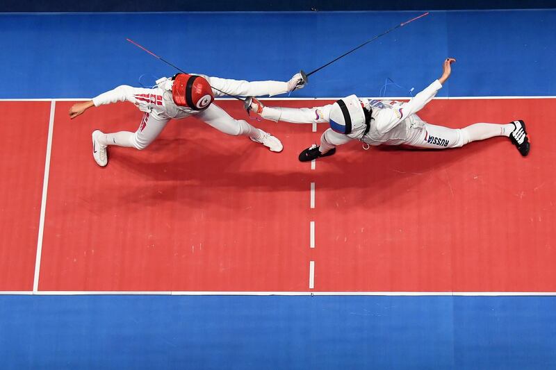 RIO DE JANEIRO, BRAZIL - AUGUST 10:  Aida Shanaeva of Russia (R) and Ines Boubakri of Tunisia compete during the women's individual foil bronze medal bout on Day 5 of the Rio 2016 Olympic Games at Carioca Arena 3 on August 10, 2016 in Rio de Janeiro, Brazil.  (Photo by Ian Walton/Getty Images)