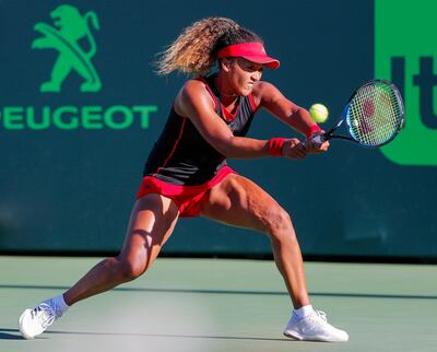 epa06619093 Naomi Osaka of Japan in action against Serena Williams of the US during a first round match at the Miami Open tennis tournament on Key Biscayne, Miami, Florida, USA, 21 March 2018.  EPA/ERIK S. LESSER