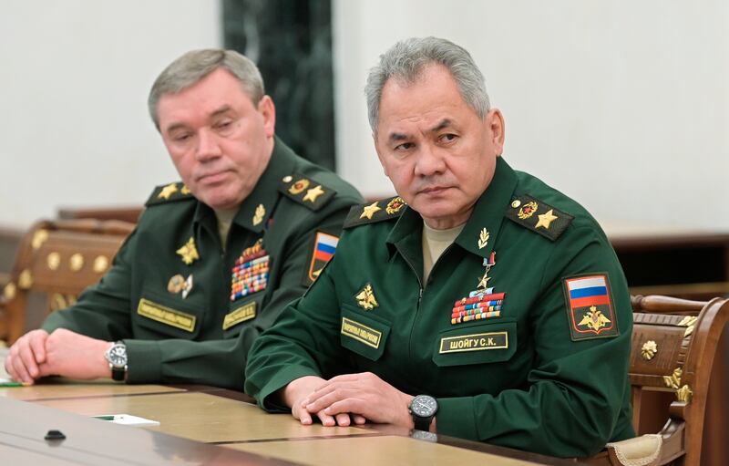 Russian Defence Minister Sergei Shoigu (R) and Chief of the General Staff Valery Gerasimov listen to a speech by President Vladimir Putin in Moscow. AP Photo