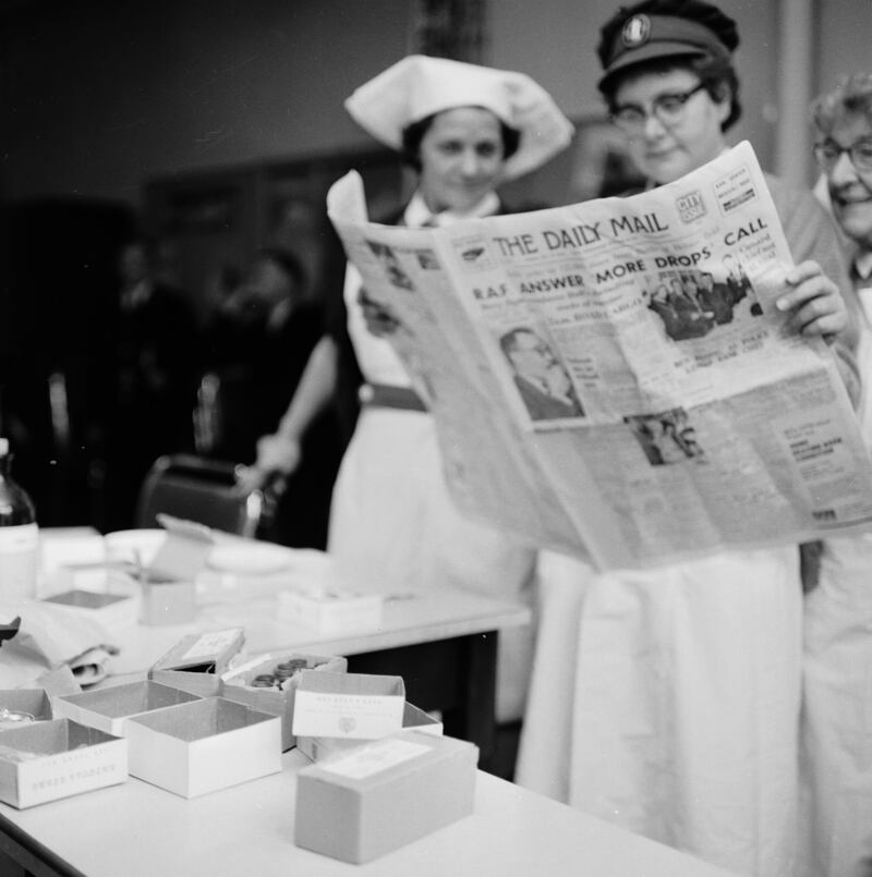 Nurses in one of the many emergency polio vaccination clinics in Hull read the latest reports on the health scare in 1961.