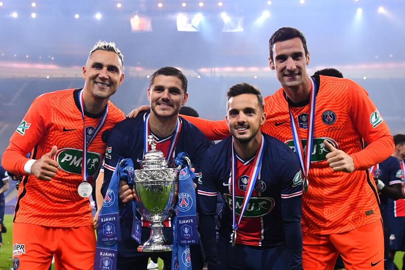 From left: Keylor Navas, Mauro Icardi, Pablo Sarabia and Sergio Rico celebrate with the trophy.