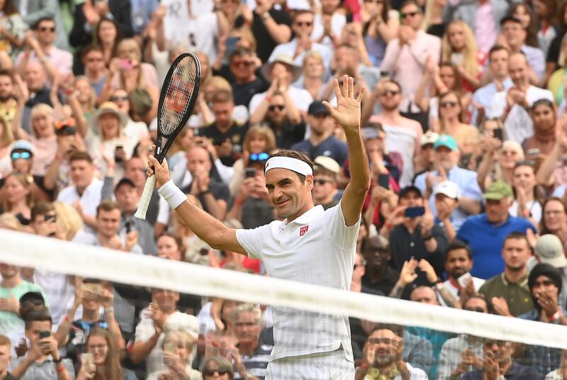 Roger Federer celebrates after beating Richard Gasquet in straight sets at Wimbledon on Thursday. EPA