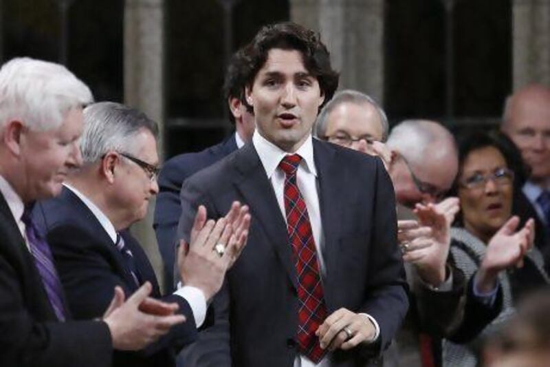 Liberal leader Justin Trudeau receives a standing ovation from his caucus in the House of Commons on Parliament Hill in Ottawa.