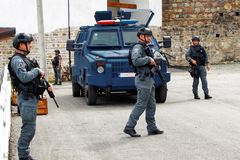 Kosovo police officers patrol Banjska village in the aftermath of a shooting. Reuters