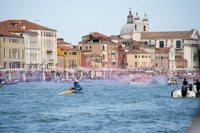 'No Big Ships' activists stage a protest as the MSC Orchestra cruise ship leaves Venice, Italy. AP Photo 