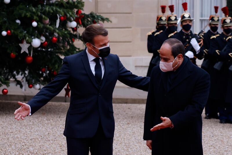 French President Emmanuel Macron greets Egyptian President Abdel Fattah El Sisi at the Elysee Palace.  EPA